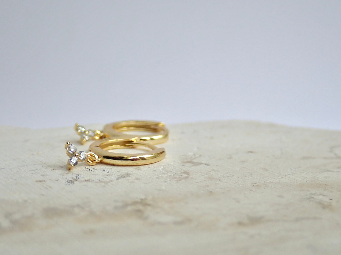 Tiny Huggie Hoop Earrings with Trefoil Crystal Charm – Gold or Sterling Silver