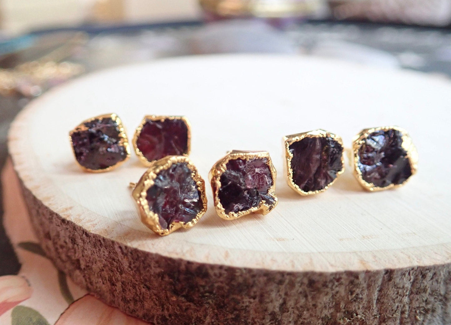 raw dark red garnets surrounded in 14k gold plating.  Ear jackets and posts also 14k gold plated.  Approximate size is 8mm round.